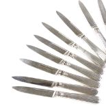 A set of 18 George IV silver dinner knives, with silver blades and reeded handles, mostly by