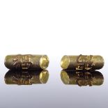 A pair of 14ct gold Chinese character mark cufflinks, slanted cylindrical textured finish, panel