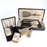 2 cased silver-backed dressing table sets, including hand mirror, brushes etc Both in good
