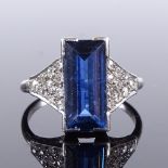 An Art Deco platinum sapphire and diamond cluster panel ring, rectangular-cut sapphire approx 2.6ct,