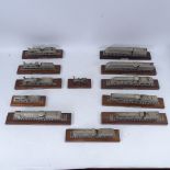 A collection of Danbury Mint pewter model toy cars and locomotives on display stands