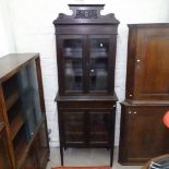 An Edwardian mahogany 2-section bookcase, with carved raised pediment, 4 glazed panelled doors,