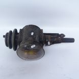 A black painted cast-iron carriage oil lamp with wall mounting bracket, lamp height 51cm