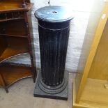 An ebonised Corinthian column on stepped plinth base, W30cm, H100cm