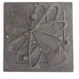 A cast-brass Atom 571 plaque, height 19.5cm