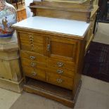 A Vintage oak Dentist's cabinet, raised back, fitted with drawers and cupboards, W76cm, D44cm,