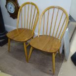 Pair of Ercol elm-seated and beech stick-back chairs