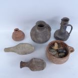A quantity of Middle Eastern pottery antiquities and fragments, including wine jug, vessels and