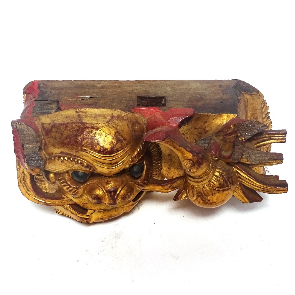 A painted and gilded wood Dog of Fo carving, and a Chinese carved hardwood figure of a Sage, Sage - Image 2 of 3