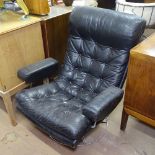 A mid-century buttoned upholstered swivel armchair on chrome base