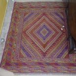 A red ground Gazak rug, 127cm x 114cm