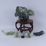 A collection of Oriental carved jadeite and soapstone figures, including large fruit basket,