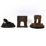 A Grand Tour bronze Arc de Triomphe jewel box, small bronze nude sculpture, and a cast-brass Arch of