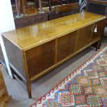 A Danish mid-century elm sideboard/credenza, fitted with 4 cupboard doors, brass-ring drop