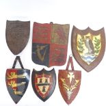 A collection of carved and painted wood armorial plaques, largest height 30cm