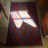 A red ground Beluchi rug, 143cm x 87cm