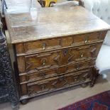 An Antique Jacobean style oak chest, with 4 long drawers with applied moulded decoration, on bun