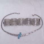 A Peruvian sterling silver Aztec pierced and embossed 5-panel bracelet, and a sterling silver and