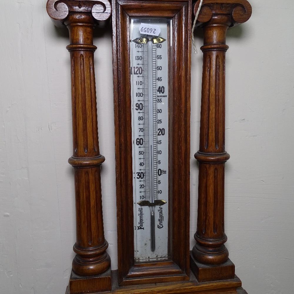 An Edwardian carved oak-cased aneroid wall barometer and thermometer, with brass presentation plaque - Image 3 of 3