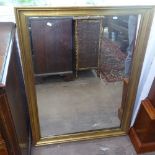 A rectangular gilt-framed wall mirror, 83cm x 113cm