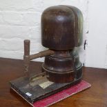 An Antique stained beech millinery hat stretcher, overall height 33cm