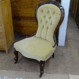 A Victorian walnut-framed and button upholstered nursing chair