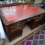 An unusual Victorian mahogany twin-pedestal writing desk, with leather skiver and 5 short fitted