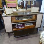 A mid-century walnut-cased German stereogram, with Telefunken 504 turntable, W131cm, D37cm, H84cm