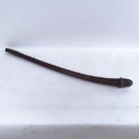 An African Tribal carved hardwood phallus fertility stick, length 83cm