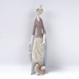 Lladro figure of a lady with a parasol and dog, 36cm