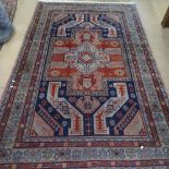 A blue and red ground Caucasian rug, 240cm x 150cm