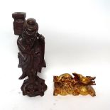 A painted and gilded wood Dog of Fo carving, and a Chinese carved hardwood figure of a Sage, Sage