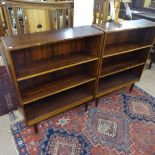 A pair of 1950s Danish rosewood open bookcases, with adjustable shelves, on turned legs, W88cm,