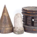 An African Tribal carved and stained hardwood stool, an 18th century carved stone corn loft plug,