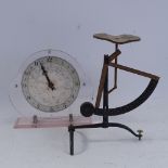 An Art Deco pink lucite mantel clock, and a set of postal scales, clock height 18cm (2)