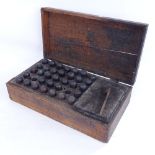 A 19th century set of printer's letter and number punches, with turned wood handles and brass