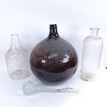 A large cinnamon brown Chemist's carboy glass transporting jar, 2 other large glass storage