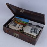 A small leather-covered briefcase, containing various topographical and other postcards