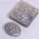 A German silver pillbox, and a Swedish silver pillbox, both with relief embossed decoration (2)
