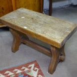 A rectangular elm stool on tablet supports, W61cm, D30cm, H38cm