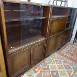 A set of 3 mahogany cabinets, to include 2 bookcases with sliding glass and panelled cupboard doors,