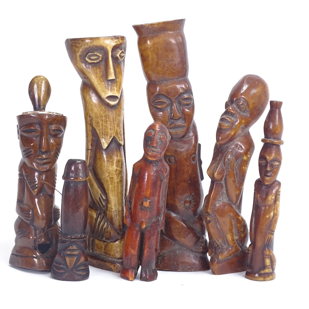 A group of 19th century African Tribal carved and stained ivory and bone figures, probably Lega,