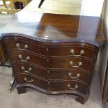 A mahogany serpentine bachelor's chest with brushing slide, 4 long drawers under, on bracket feet,