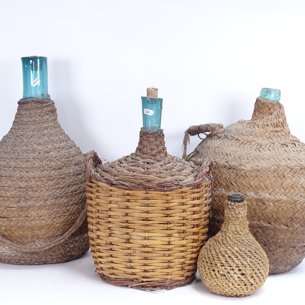 4 wicker-bound glass rum jars, largest height 52cm (4)