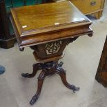 A Victorian walnut trumpet workbox, the rising top revealing a fitted interior with basket under,