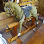 A Vintage upholstered rocking horse on pine frame, H125cm