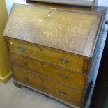 A large George III oak bureau, with 3 long graduated drawers on bracket feet, W98cm, H111cm