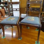 A set of 4 Regency mahogany dining chairs, with carved table-top rails, cane panelled seats, and