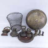 Various cast-iron doorstops, a cast-brass framed circular mirror, and a large cast-brass domed gong