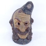 An Art Deco painted papier mache policeman carnival mask, by Pytram, height 41cm